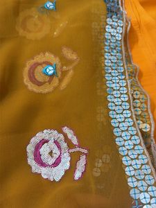 Vibrant orange unstitched suit  Embroidered Saree