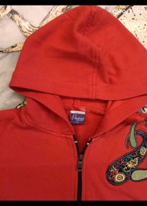 23. Red Zip-Up Hoodie with Paisley Design