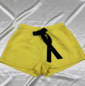 Yellow Shorts with Black Ribbon