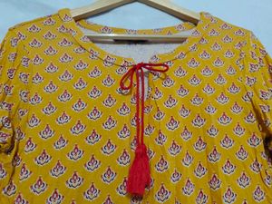 Yellow Printed Peplum Kurti with Bell Sleeves
