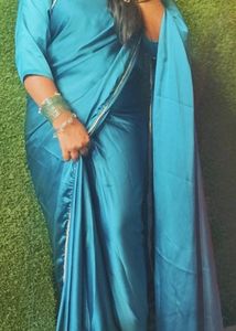 Elegant Teal Satin Saree with Pearl Embellishments