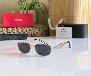 Prada Sunglasses - Gold Frame