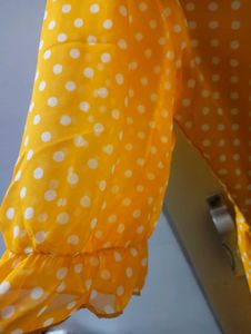 yellow long frockwith white dots