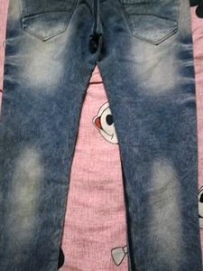 Distressed Blue Denim Jeans
