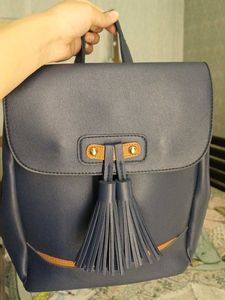 Blue leatherite backpack with magnetic shutters