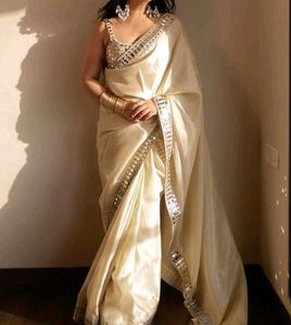 Elegant Cream Saree with Embellished Blouse