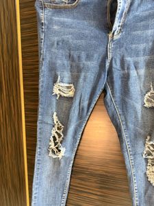 Distressed Blue Denim Jeans