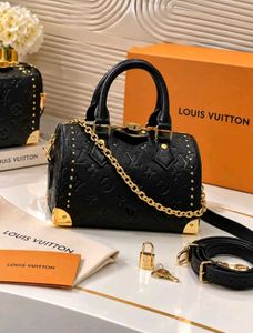 Louis Vuitton Speedy-style studded trunk handbag w
