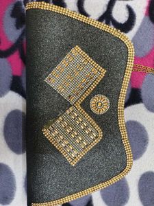 Sparkling Black Clutch with Gold Embellishments