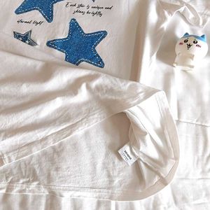 White T-Shirt with Blue Star Appliques