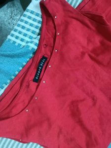 Red Sleeveless Top with Embellishments