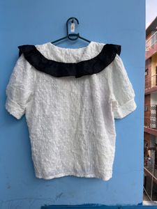 Chic White Top with Black Collar