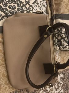Elegant Beige Handbag with Black Handles