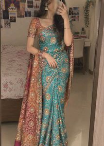 Stunning Teal Saree with Intricate Embellishments