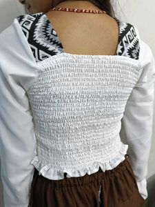 White top with black pattern