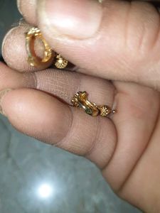 Gold Dangle Earrings with Intricate Design