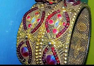 Elegant Gold and Ruby Bangle