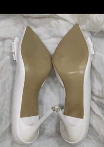 Elegant White D'Orsay Heels with Bow Detail