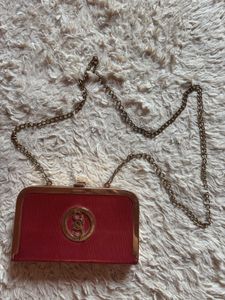 Elegant Red Clutch with Gold Accent