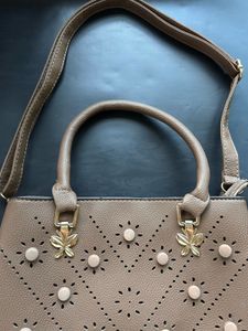 Stylish Taupe Handbag with Perforated Design