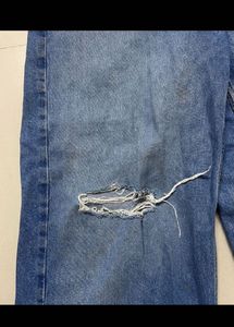 Distressed Blue Denim Jeans