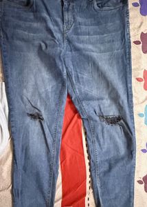 Distressed Blue Denim Jeans