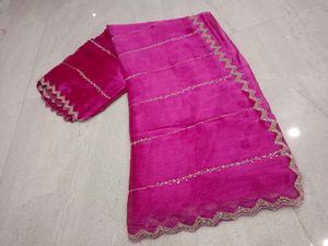 Vibrant Pink Saree with Intricate Embellishments