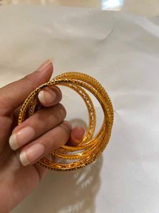 Elegant Gold Tone Bangle Set