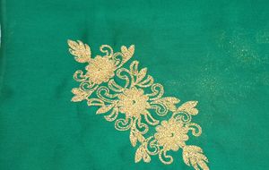 Dark green golden embroidery fabric with work on both sides (upper part and bottom part both have golden embroidery work), patches of work in between.7 meter cloth.