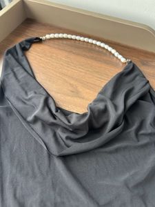 Black backless halter neck top with pearls
