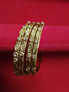 Elegant Gold Tone Bangles with Stones