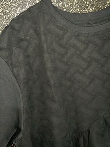 Stylish Black Top with Ruffle Detail