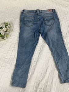 Light Wash Distressed Denim Jeans