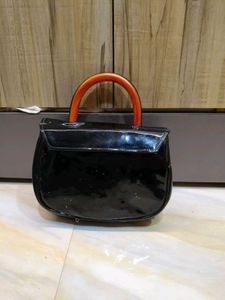 Chic Black Patent Handbag with Wooden Handle