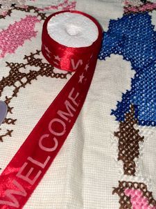 Red Ribbon with "Welcome" Text