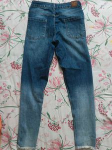 Distressed Blue Denim Jeans