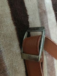 Small adjustible shoulder belt for vanity bags.