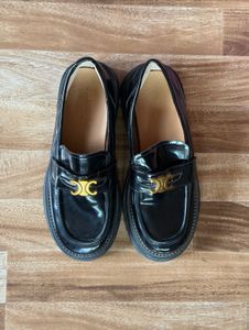 Chic Black Patent Loafers with Gold Accent