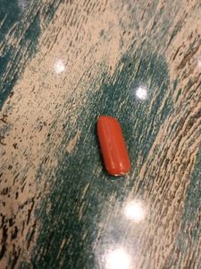 Red Bullet-Shaped Trinket