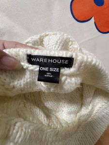 creamy-white knit,  textured cable pattern