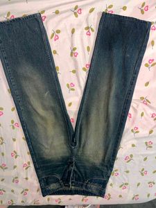 Faded indigo blue denim jeans