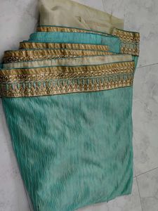 Elegant green Saree with Gold Border