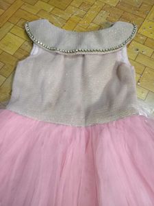 Sparkling Pink Tulle Gown with Feather Trim