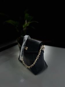 Leather Sling Bag.