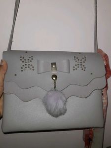 Grey Bow Detail Crossbody Bag with Pom Po