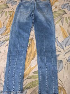 Distressed Blue Denim Jeans