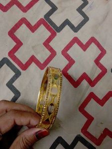 Elegant Gold Tone Bangle