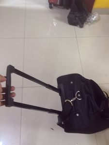 Kamiliant Black Rolling Suitcase