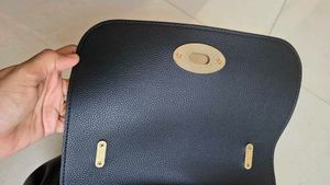 Chic Black Handbag with Gold Chain