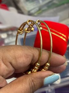 Elegant Gold Toned Earrings with Red Stones